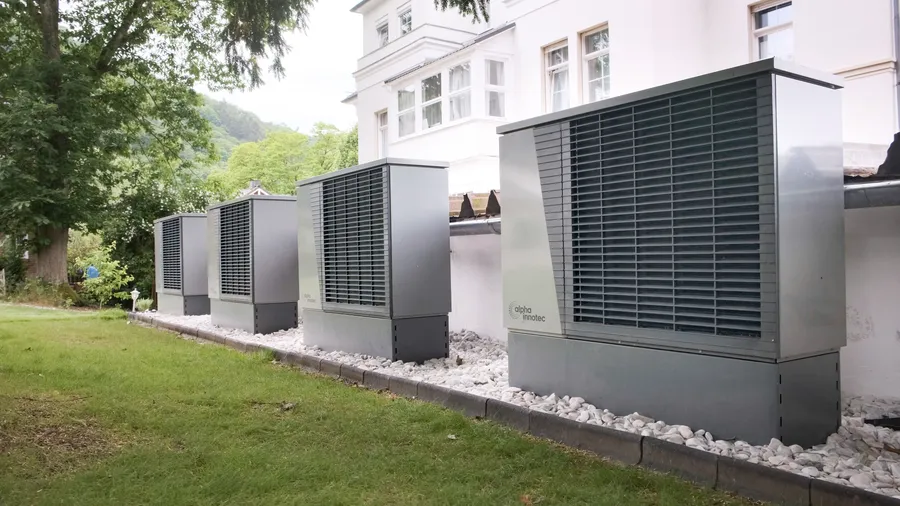 Row of heat pump units serving a residence